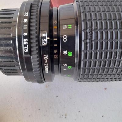 Two 35 mm camera lenses - Sigma - Vivitar 2X Tele Converter both with instructions 35mm camera