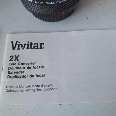 Two 35 mm camera lenses - Sigma - Vivitar 2X Tele Converter both with instructions 35mm camera