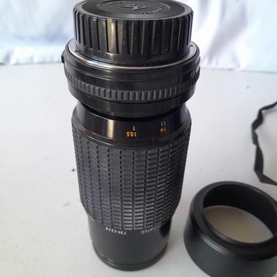 Two 35 mm camera lenses - Sigma - Vivitar 2X Tele Converter both with instructions 35mm camera