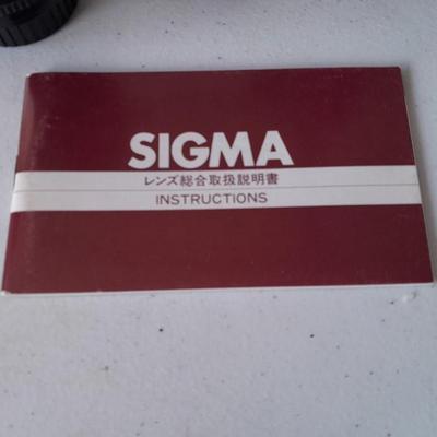 Two 35 mm camera lenses - Sigma - Vivitar 2X Tele Converter both with instructions 35mm camera