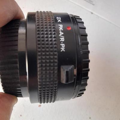 Two 35 mm camera lenses - Sigma - Vivitar 2X Tele Converter both with instructions 35mm camera