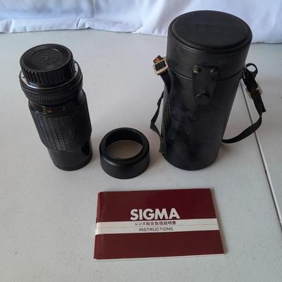 Two 35 mm camera lenses - Sigma - Vivitar 2X Tele Converter both with instructions 35mm camera