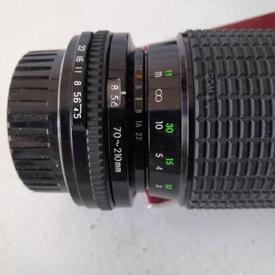 Two 35 mm camera lenses - Sigma - Vivitar 2X Tele Converter both with instructions 35mm camera
