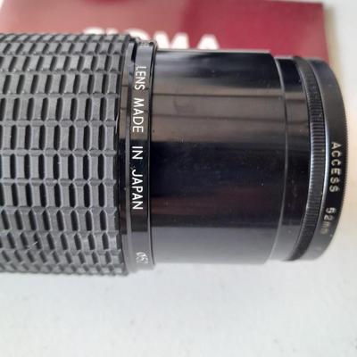 Two 35 mm camera lenses - Sigma - Vivitar 2X Tele Converter both with instructions 35mm camera