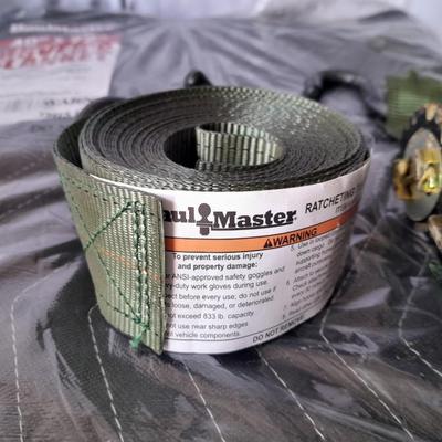 New moving blanket with like new wide Haul Master ratchet strap