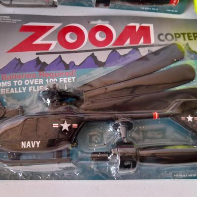Two new in package ZOOM Copter Zooms over 100 feet no batteries required with new Poof football