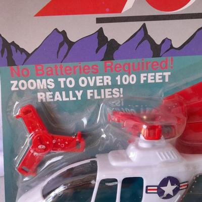 Two new in package ZOOM Copter Zooms over 100 feet no batteries required with new Poof football