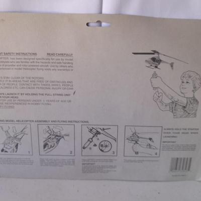 Two new in package ZOOM Copter Zooms over 100 feet no batteries required with new Poof football