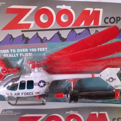 Two new in package ZOOM Copter Zooms over 100 feet no batteries required with new Poof football