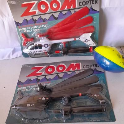 Two new in package ZOOM Copter Zooms over 100 feet no batteries required with new Poof football
