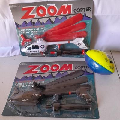 Two new in package ZOOM Copter Zooms over 100 feet no batteries required with new Poof football