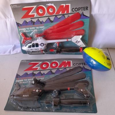 Two new in package ZOOM Copter Zooms over 100 feet no batteries required with new Poof football