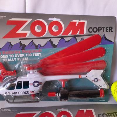 Two new in package ZOOM Copter Zooms over 100 feet no batteries required with new Poof football