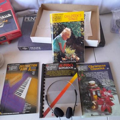 Board games and brand-new puzzles - new cribbage - bag of ducks - Yahtzee - Pente -Keyboard starter kit