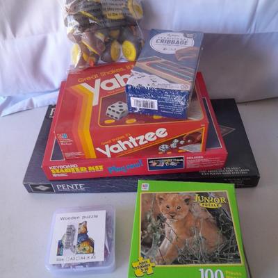 Board games and brand-new puzzles - new cribbage - bag of ducks - Yahtzee - Pente -Keyboard starter kit