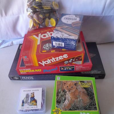 Board games and brand-new puzzles - new cribbage - bag of ducks - Yahtzee - Pente -Keyboard starter kit