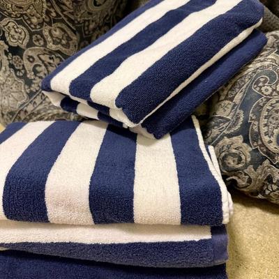 A King Size Comforter with 2 Matching pouf style Stools and a set of Navy/White towels from Pottery Barn Kids