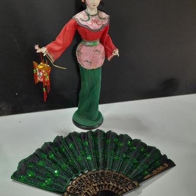 Asian doll with beautiful hand fan