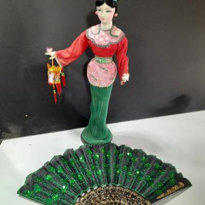 Asian doll with beautiful hand fan