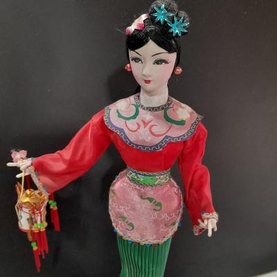 Asian doll with beautiful hand fan