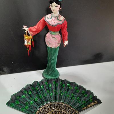 Asian doll with beautiful hand fan