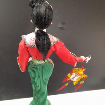 Asian doll with beautiful hand fan