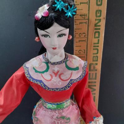 Asian doll with beautiful hand fan