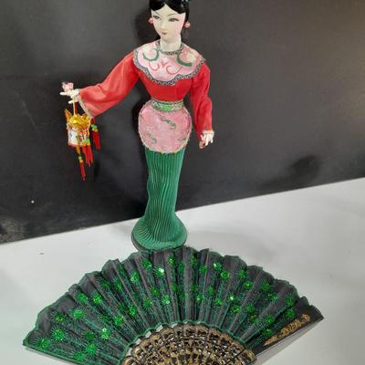 Asian doll with beautiful hand fan