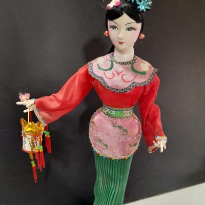 Asian doll with beautiful hand fan