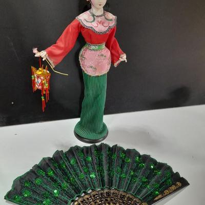 Asian doll with beautiful hand fan