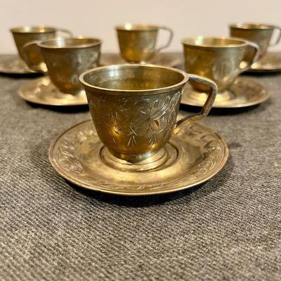 6 brass tea cups and saucers