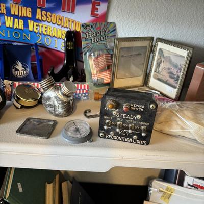 Airplane light switch, WWIl gun oil can, flags, pictures and hats, Military Memorabilia