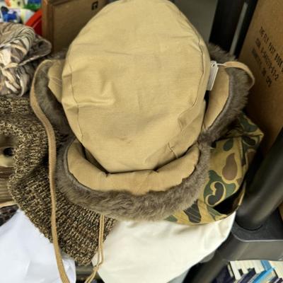 Camo hats, gloves, and military literature