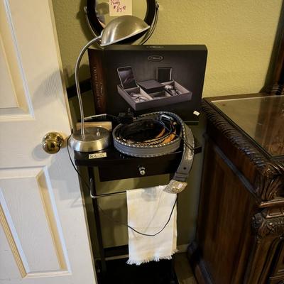 Men’s valet stand, belts and light.