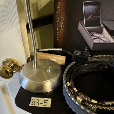 Men’s valet stand, belts and light.