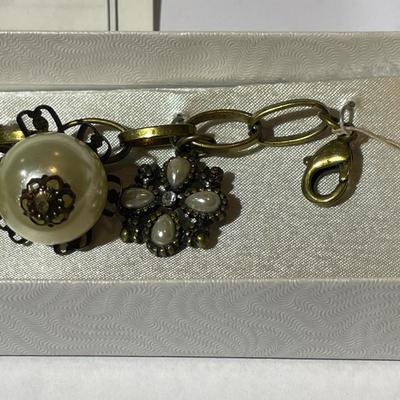 Vintage Mid-Century Antiqued Brass Charm Bracelet by Decade with Miscellaneous Charms as Pictured.