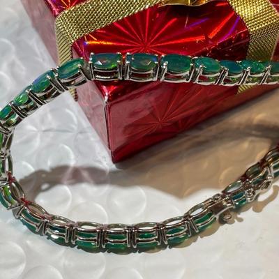 Vintage Simulated Emerald Tennis Bracelet in Sterling Silver 7.25" Long in Good Preowned Condition.