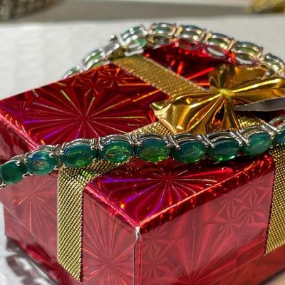 Vintage Simulated Emerald Tennis Bracelet in Sterling Silver 7.25" Long in Good Preowned Condition.