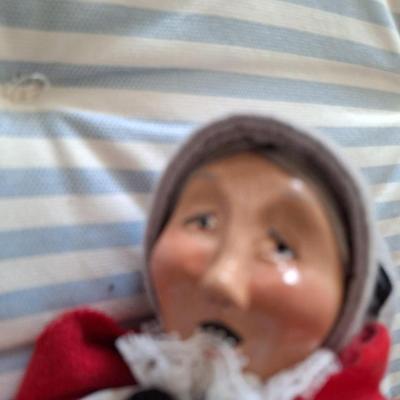 Woman caroler with gray muff