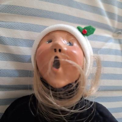 woman caroler with muff black top