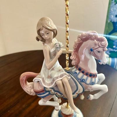Lladro Girl #1469 Riding carousel Horse *flower missing off the very top.