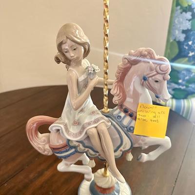 Lladro Girl #1469 Riding carousel Horse *flower missing off the very top.