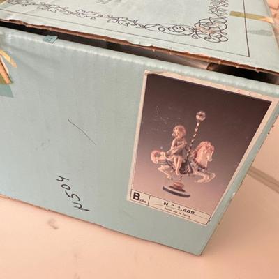 Lladro Girl #1469 Riding carousel Horse *flower missing off the very top.