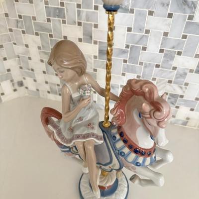 Lladro Girl #1469 Riding carousel Horse *flower missing off the very top.