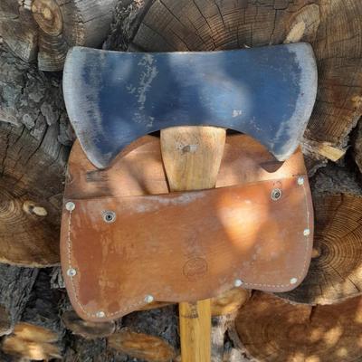 Lots of Firewood with a nice double-sided Axe to split it with and a fireplace tool set