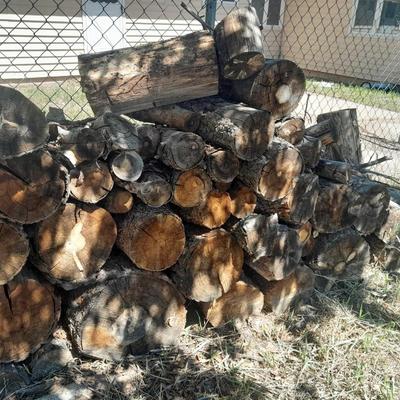 Lots of Firewood with a nice double-sided Axe to split it with and a fireplace tool set