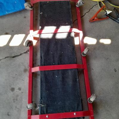 Car Creeper - Jumper cables and a used blue tarp
