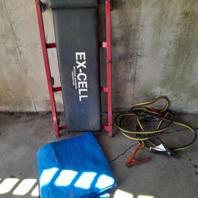 Car Creeper - Jumper cables and a used blue tarp