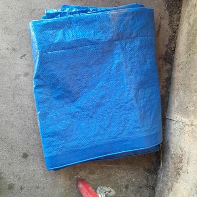 Car Creeper - Jumper cables and a used blue tarp