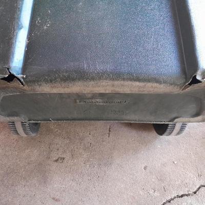 Trashcan with tarp and trash bags